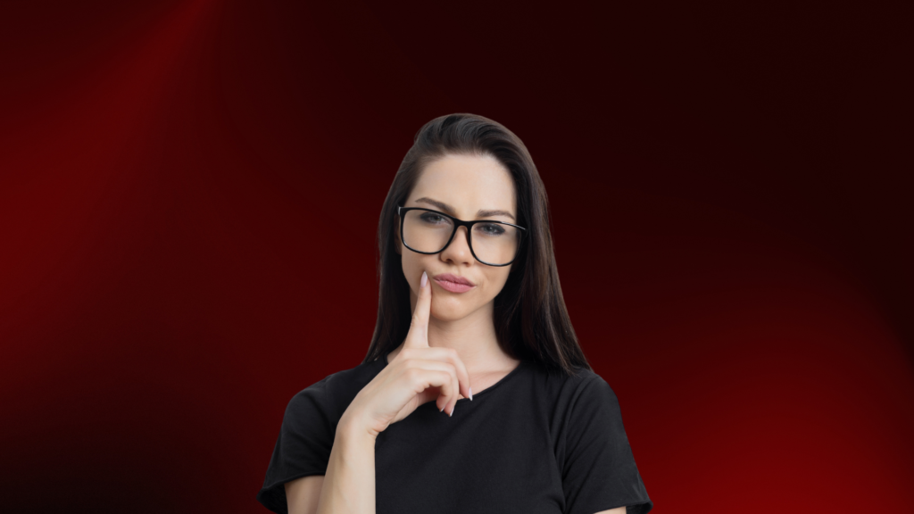 Mulher jovem com expressão pensativa e dedo no rosto, simbolizando dúvida e reflexão sobre sinais de apego evitativo em um relacionamento.