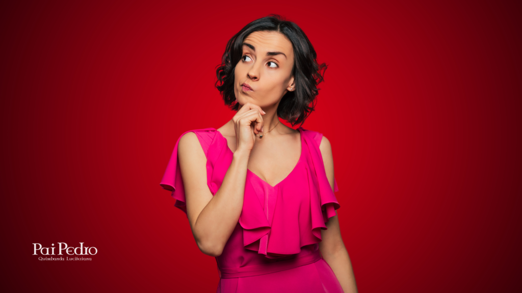 Mulher pensativa em fundo vermelho, com expressão de dúvida, representando o momento de reflexão sobre continuar ou encerrar uma relação.